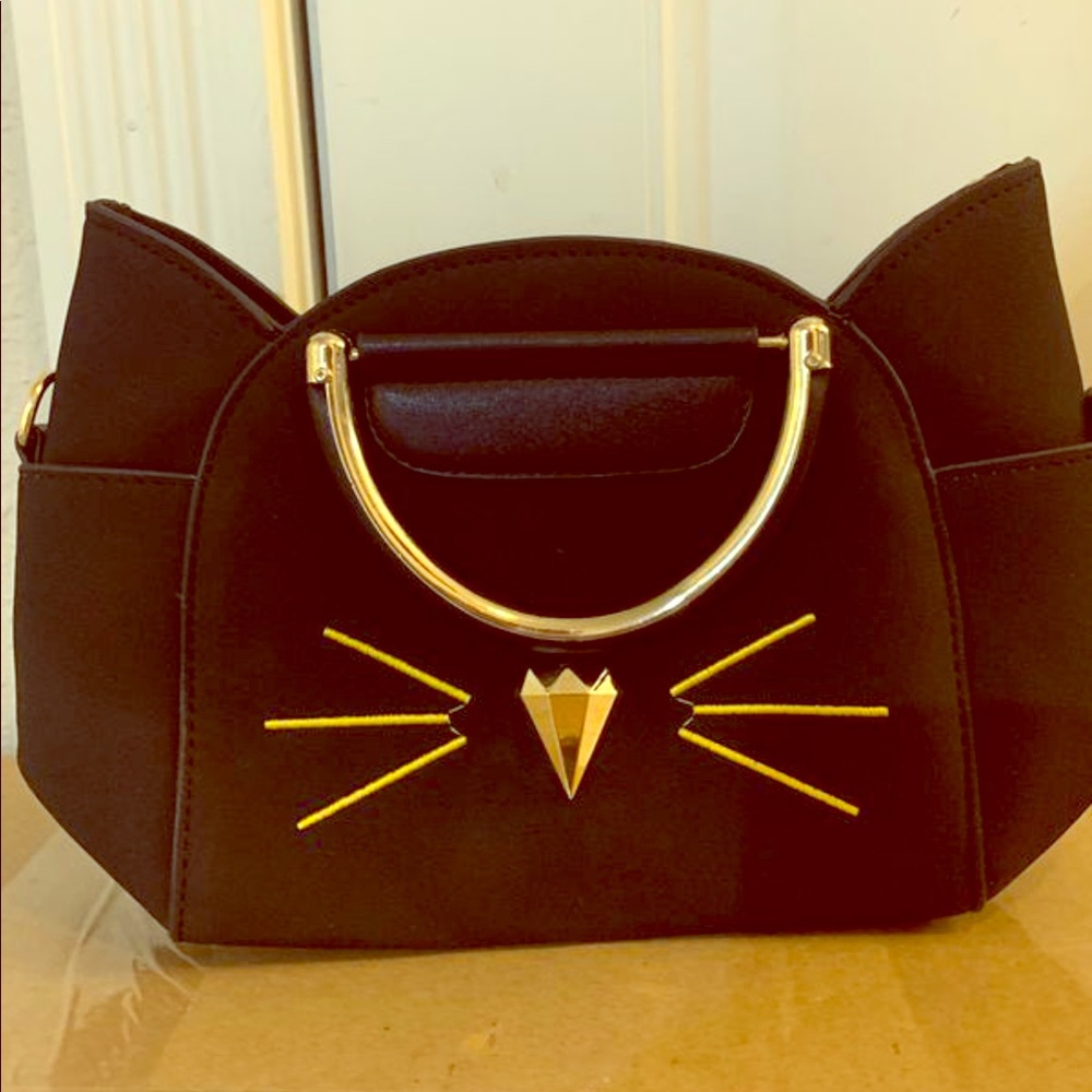 Small cat shape clutch in black with gold accents